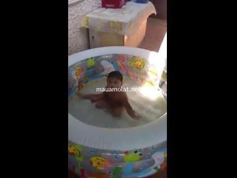 Baby swimming at the pool